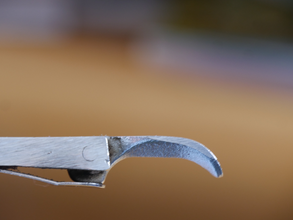 The cam in its lowered position on the Stanley lever cap remains constant when the lever is...