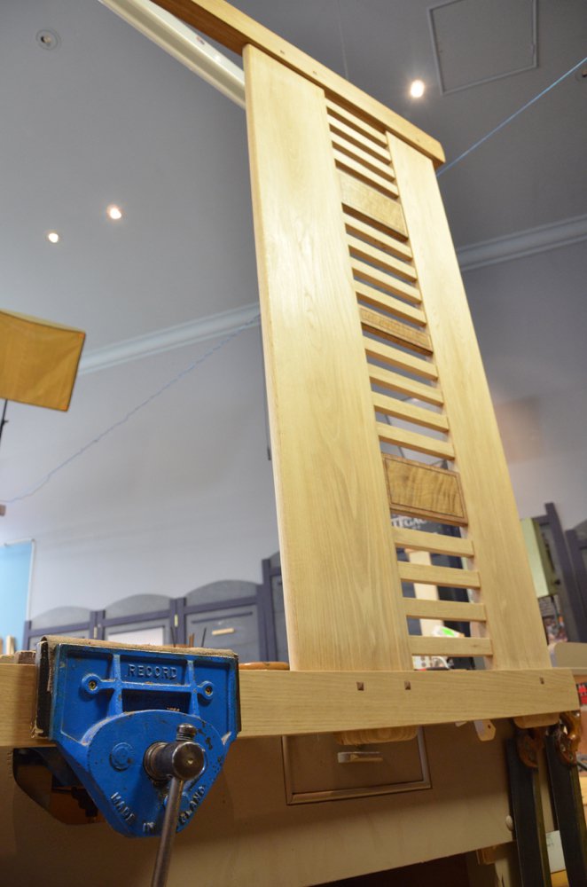 This king sized headboard in oak is 2-2 1/2" thick mostly and is held in a Qr vise overhanging 40" to the right of the vise with no other support than the one vise jaw. 