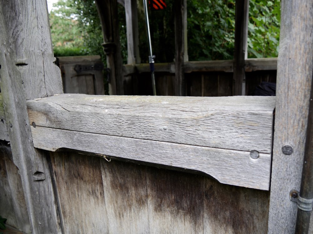 Here, instead of solid sections, replacements were laminated. Hence the separation in the laminations that starts within a year or two on outsides structures exposed to the elements.