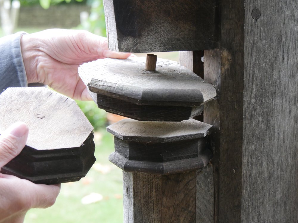 ...there behind the decorative sconce is hidden an original mortise hole into which an original arch long gone was once tenoned into.
